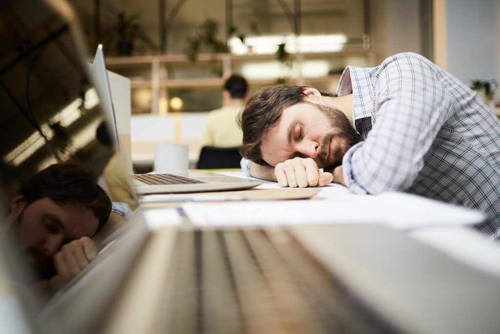 Man asleep at work